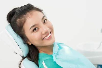 patient smiling in the dental chair at the office of Corrie J Crowe, DDS