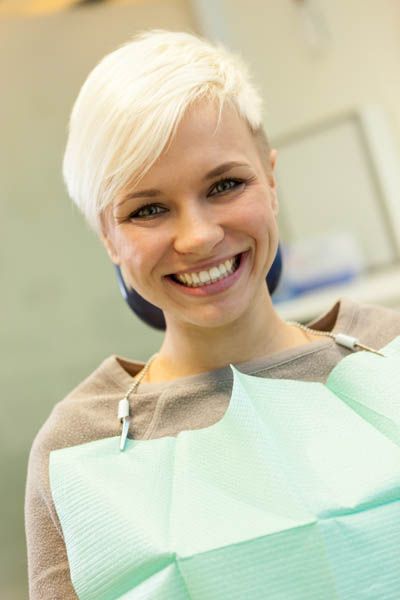 patient smiling after her gum disease has been relieved